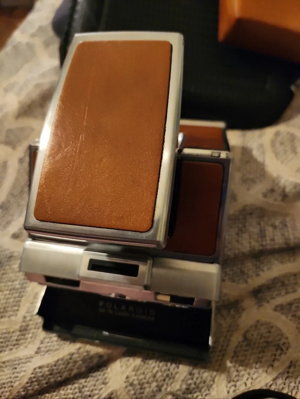 Polaroid SX-70 Land Camera in Silver with Brown and Red Accents